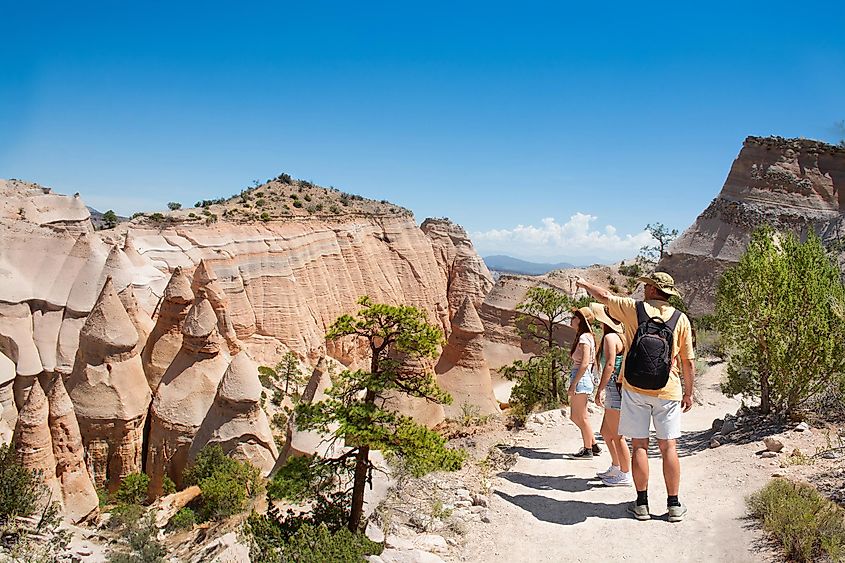 Family hiking on vacation in beautiful mountains. Kasha-Katuwe Tent Rocks National Monument, Close to Santa Fe, New Mexico, USA