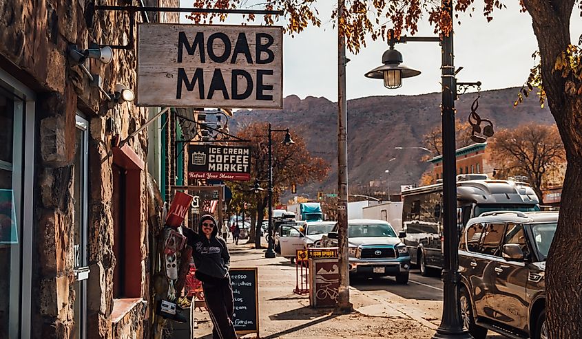 A tourist under a Moab Made sign.