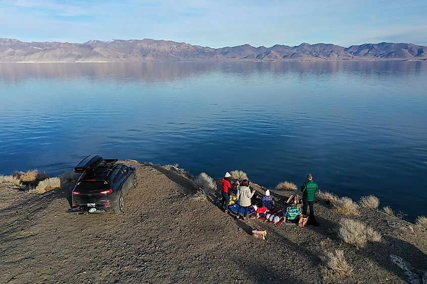 A family enjoys tranquil winter afternoon by the Pyramid Lake, Nevada
