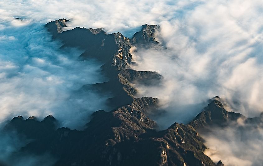 The Qinling Mountains at sunrise, showcasing majestic peaks in the distance.