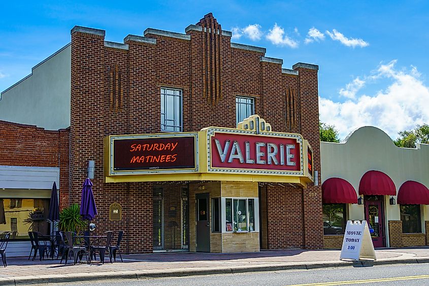 Historic Valerie Theatre in Inverness, Florida, with a brick façade, vintage marquee, and sign advertising Saturday matinees.