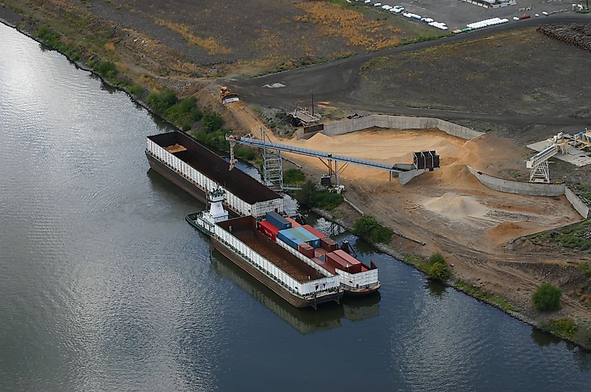 Barges being loaded at the port on the Clearwater River at Lewiston ID