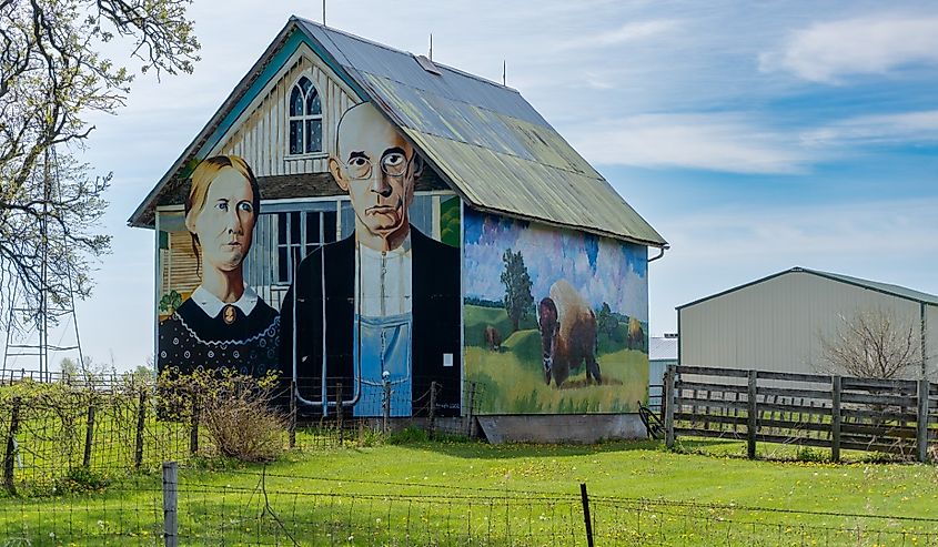 American Gothic Barn, barn-sized rendition of Grant Wood's most famous, and most parodied, painting of farming couple and nearby Iowa gothic farm house.