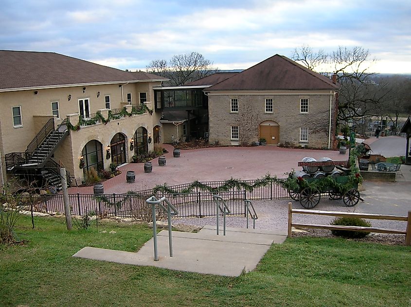 Historic Wollersheim Winery building illuminated with colorful holiday lights at night near Prairie du Sac, Wisconsin.