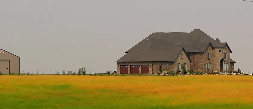 Home with golden grass in Boissevain, Manitoba.