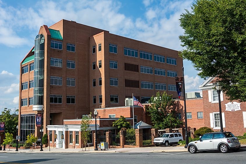 Ephrata, Pennsylvania, United States of America - September 9, 2016. Brossman Business Complex, housing the New Main Theatre on E Main St in Ephrata, PA. Street view with cars.
