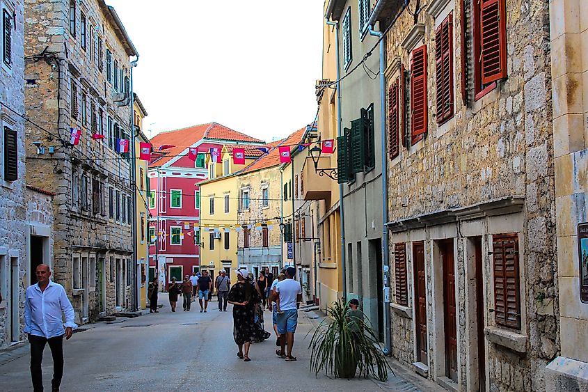 Tourists walk through the historic streets of Skradin, Croatia