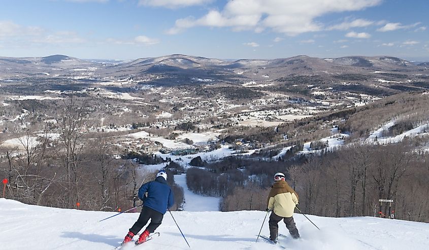 Overlooking the valley with skiers going downhill, Windham, New York, USA