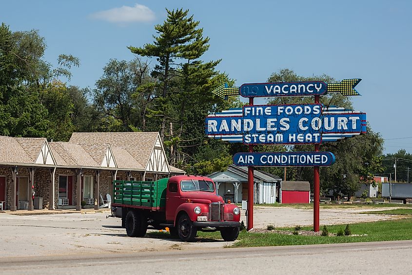 The historic Randle's Court in Eldon, Missouri, with vintage buildings lit by afternoon sunlight