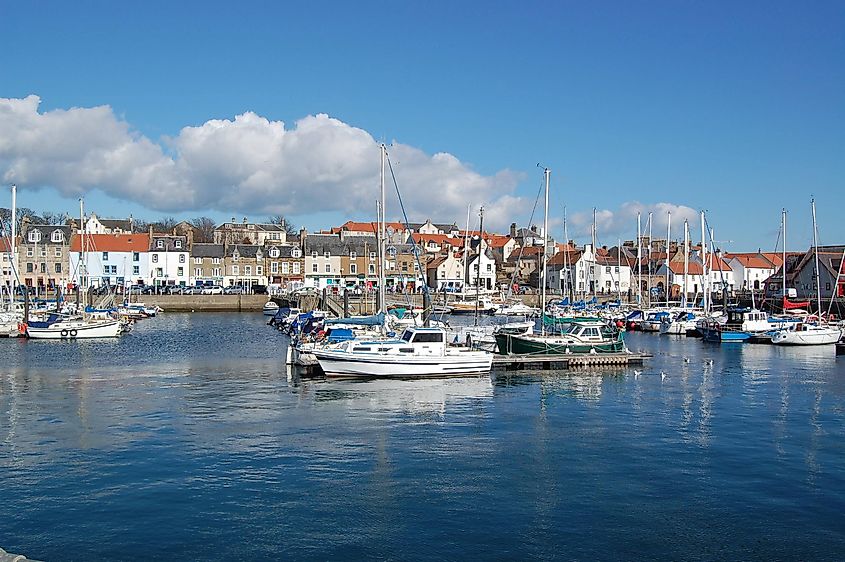 Harbor in Anstruther, Scotland: A picturesque view of buildings, boats, and the sea in this charming Fife town's harbor.