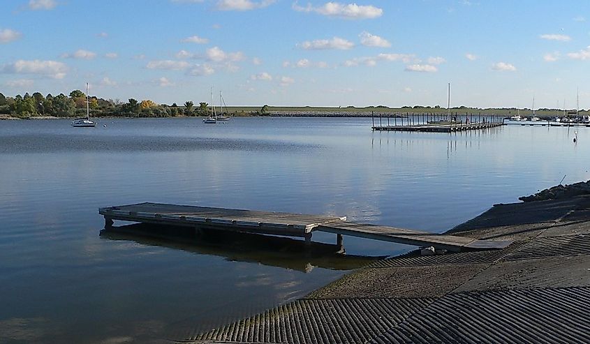 Dock and boats on the water at the marina cove at Branched Oak Lake, located in rural Lancaster County, Nebraska
