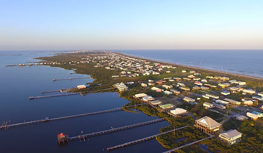 Stilt houses with long docks in the low-lying town of Grand Isle, Louisiana.