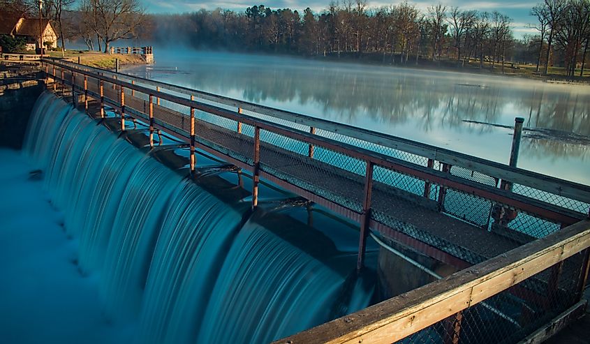 Dam of Mammoth Spring State Park, Arkansas. Water rushing down the lock. 