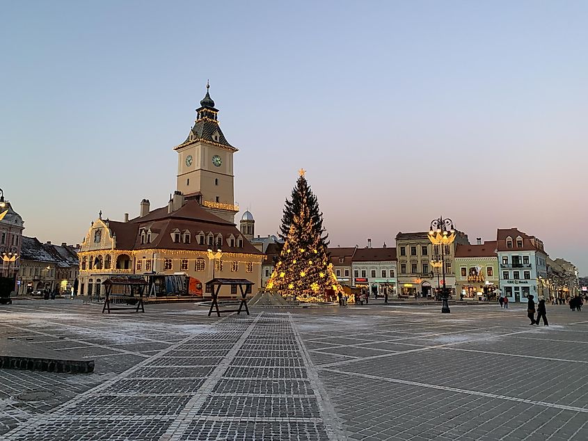 A large Christmas tree marks the focal point of the festive town square in Brasov, Romania