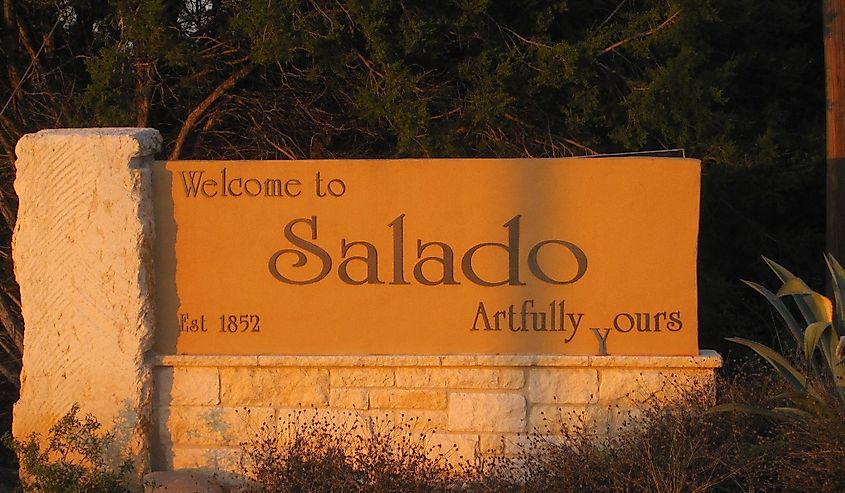 Welcome sign at Salado, TX around trees