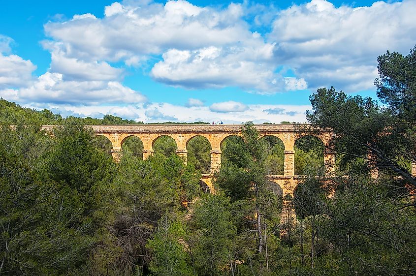 Roman pedestrian bridge Pont del Diable (Devil) in Tarragona, Spain - medieval bridge crossing the river Llobregat