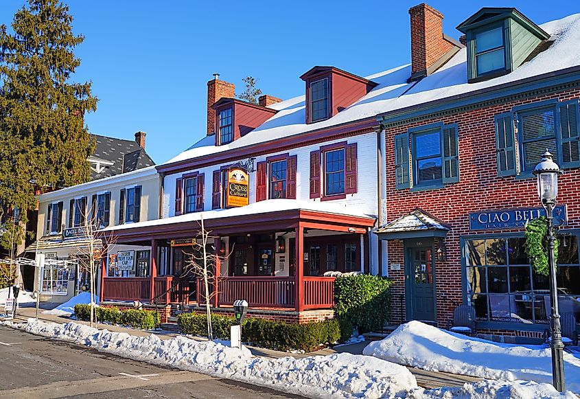 Winter scene of downtown Doylestown, Pennsylvania, showing snow-covered historic buildings and streets in Bucks County, with a tranquil, picturesque atmosphere.