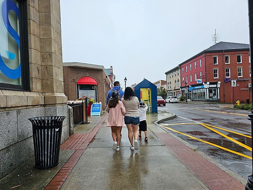 A family walking in Yarmouth, Nova Scotia.