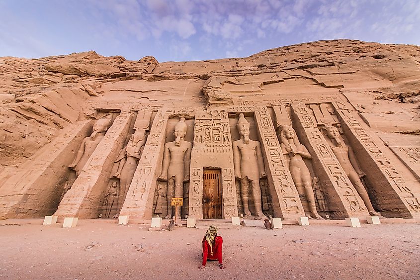 A tourist admiring the sculptures at the Abu Simbel. Image credit: Aline Fortuna/Shutterstock.com