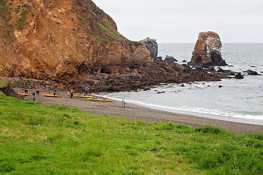 Fishermen and kayakers at Rockaway Beach, Pacifica, California, in San Francisco Bay Area.