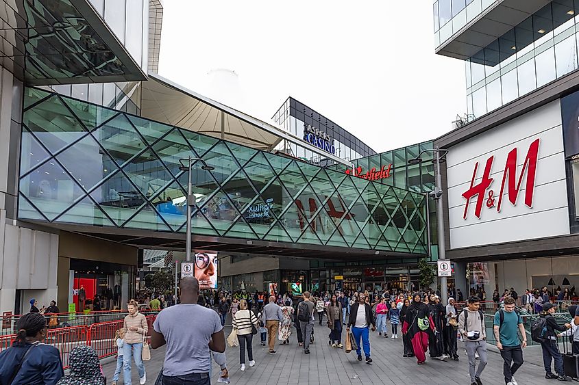 Westfield Stratford City mall entrance with shoppers. London, UK Editorial credit: Tartezy / Shutterstock.com
