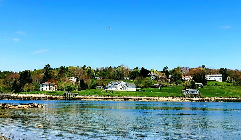 The beach near Pemaquid River in summer with houses in the background
