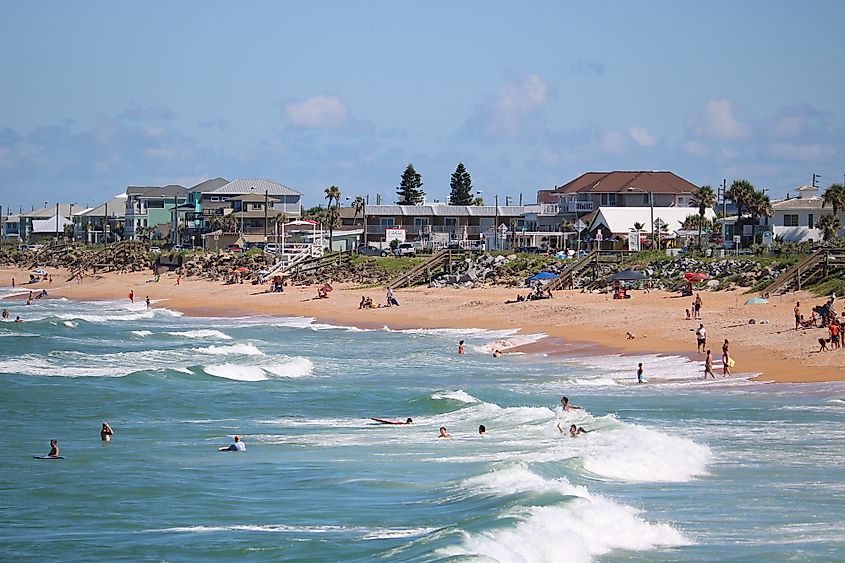 People enjoying a day at the beach in Flagler Beach.