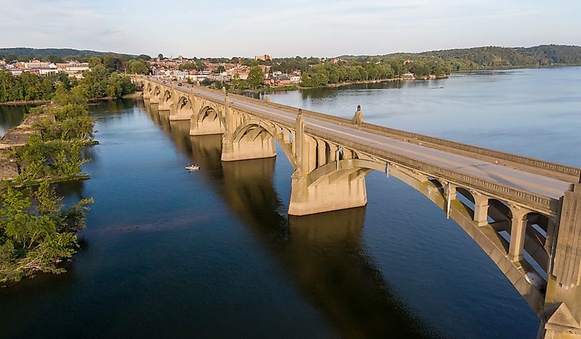 Arched bridge across river, classic architecture, aerial view of the Veterans Memorial Bridge between Wrightsville and Columbia in Pennsylvania.