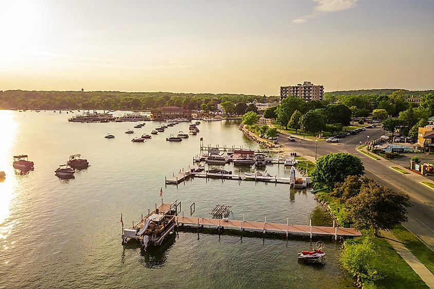 Aerial drone photo of boat piers and docks in Lake Geneva, Wisconsin.