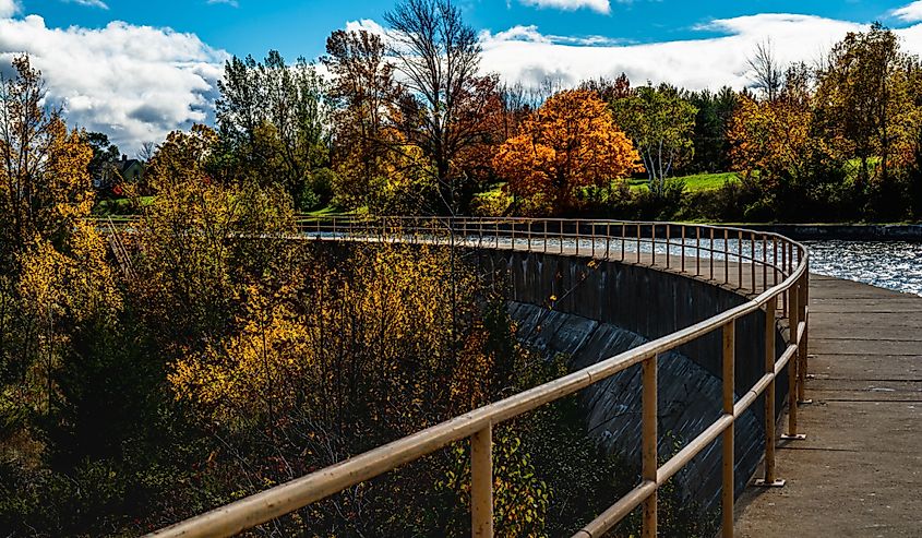Landscape fall scene featuring concrete bridge in Monroe