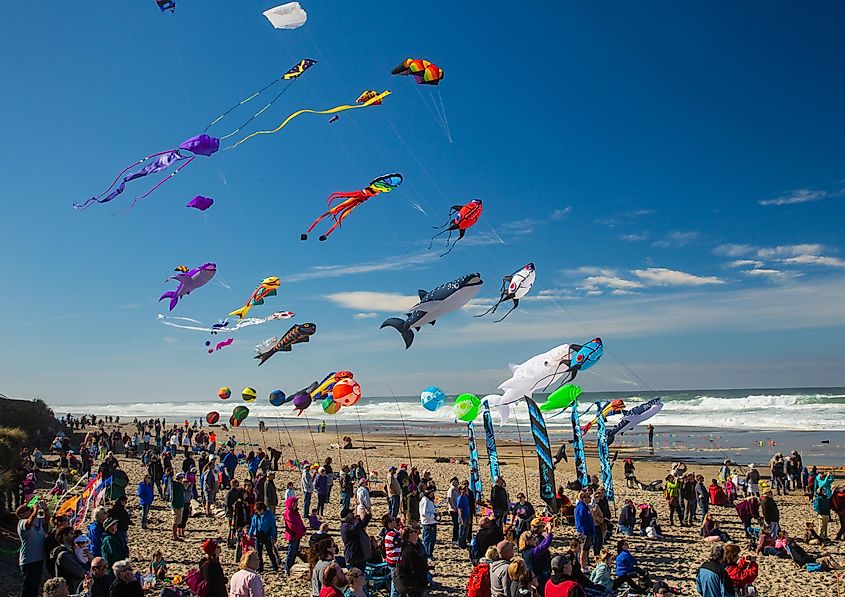 People flying kites during a kite festival in Lincoln City, Oregon.