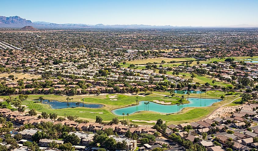 Aerial view of a mature golf course in an upscale community in east Mesa