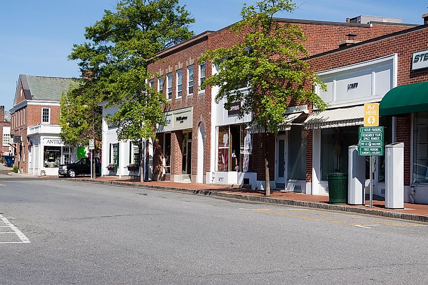 Daytime view of a street in the downtown area of New Canaan, Connecticut, via barbsimages / Shutterstock.com