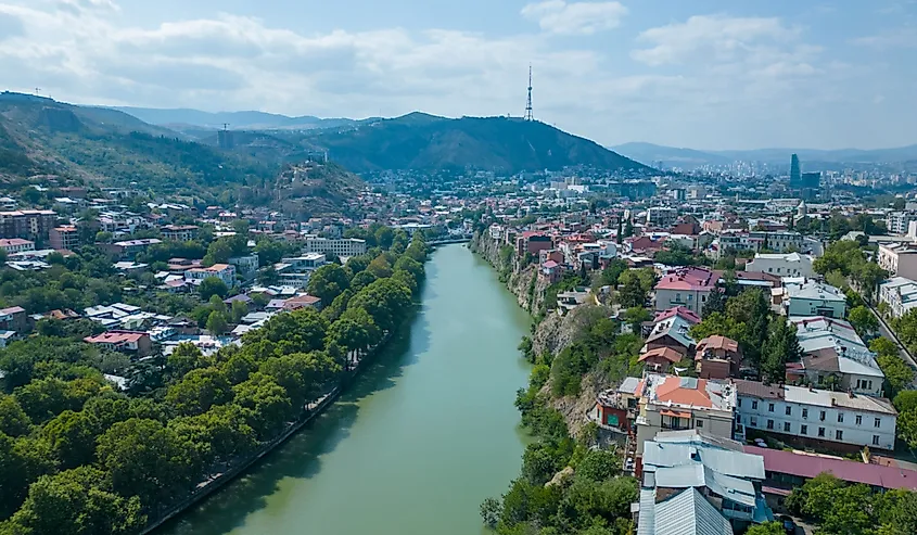 Tbilisi, Georgia panoramic skyline with old traditional houses over Mtkvari or Kura River