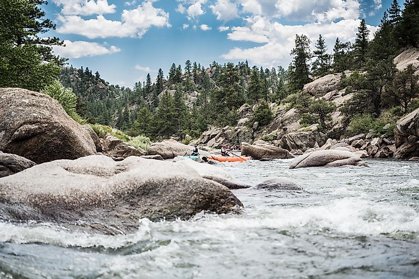 People enjoying scenic browns canyon on the Arkansas river in Salida, ColoradoTravis J. Camp / Shutterstock.com