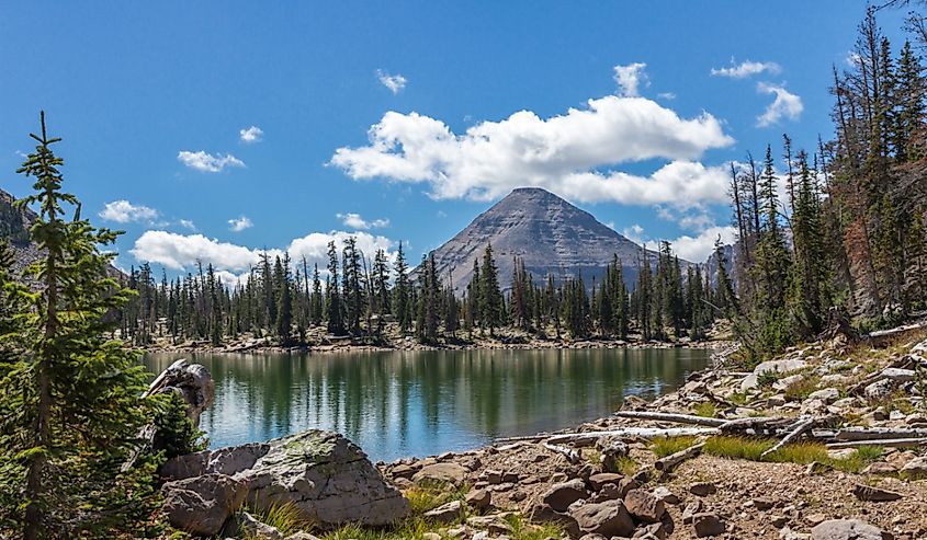 Beautiful Mirror Lake Scenic Byway with lake and mountainous range in background.