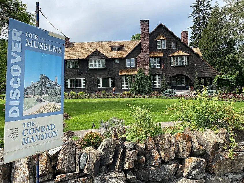 A sign introduces the Conrad Mansion - a large and impressive estate.