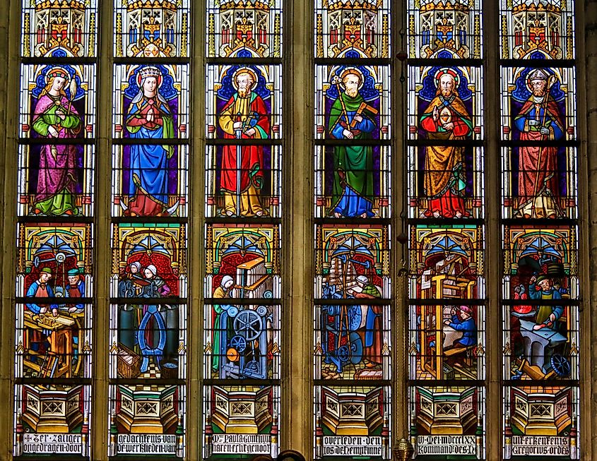 Stained Glass window depicting Catholic Saints in the Cathedral of Saint Bavo in Ghent, Flanders, Belgium.