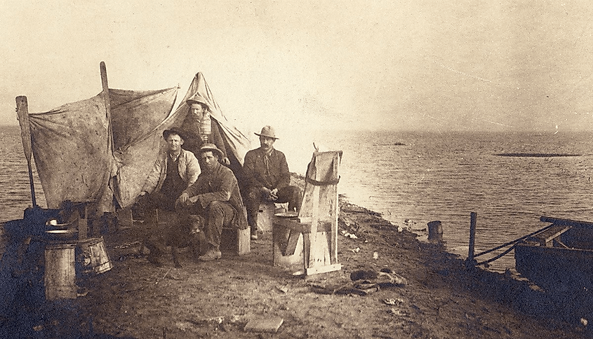 A group of men camping at the shores of Tulare Lake, 1880.