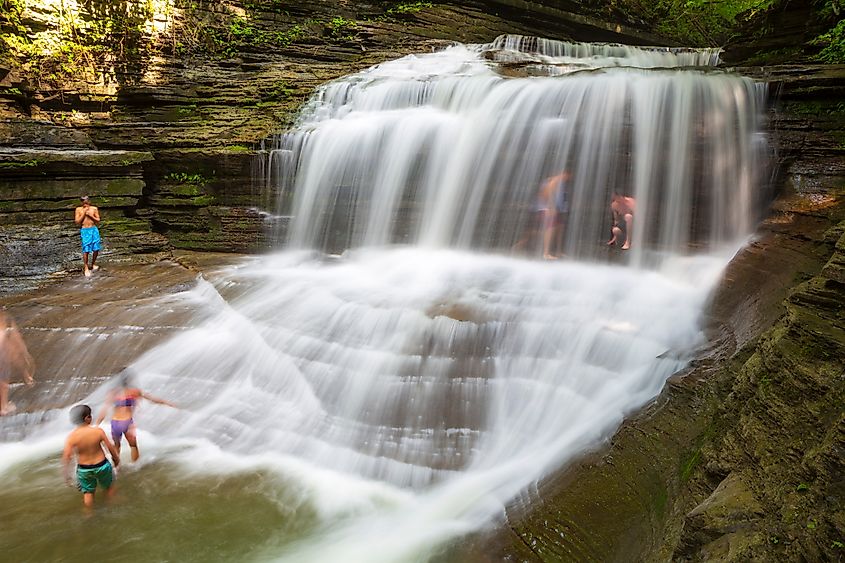 Children play at Buttermilk Falls State Park. Editorial credit: JWCohen / Shutterstock.com