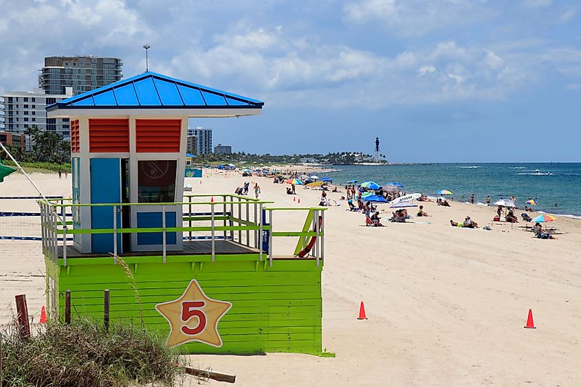 Plenty of people enjoying at the Pompano Beach shore at Pompano Beach, Florida