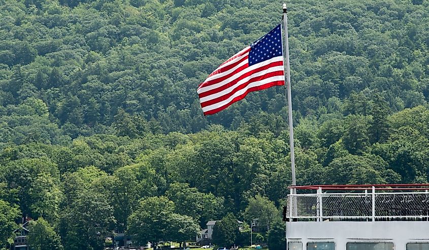 American Flag flying from the stern of a steamship on Lake George in upstate New York.