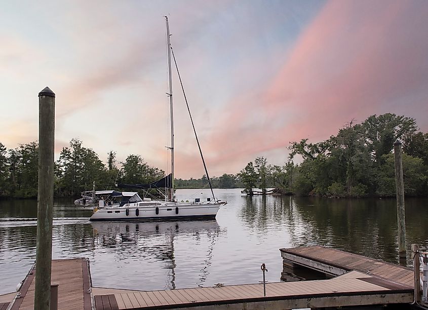 A Sailboat comes in to rest in port in the Pamlico River in Washington, North Carolina
