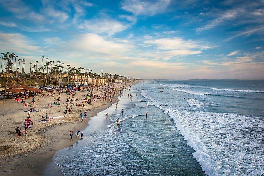 View of the beach from the pier at sunset, in Oceanside, California