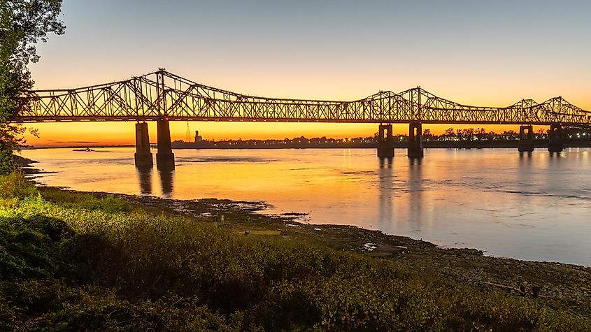 Sunset on the Mississippi River in Natchez, Mississippi, featuring the Natchez-Vidalia Bridge.