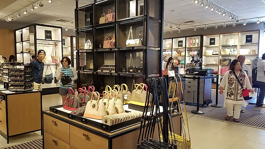 Tourists are shopping at a Coach store outlet in Waipahu, Hawaii