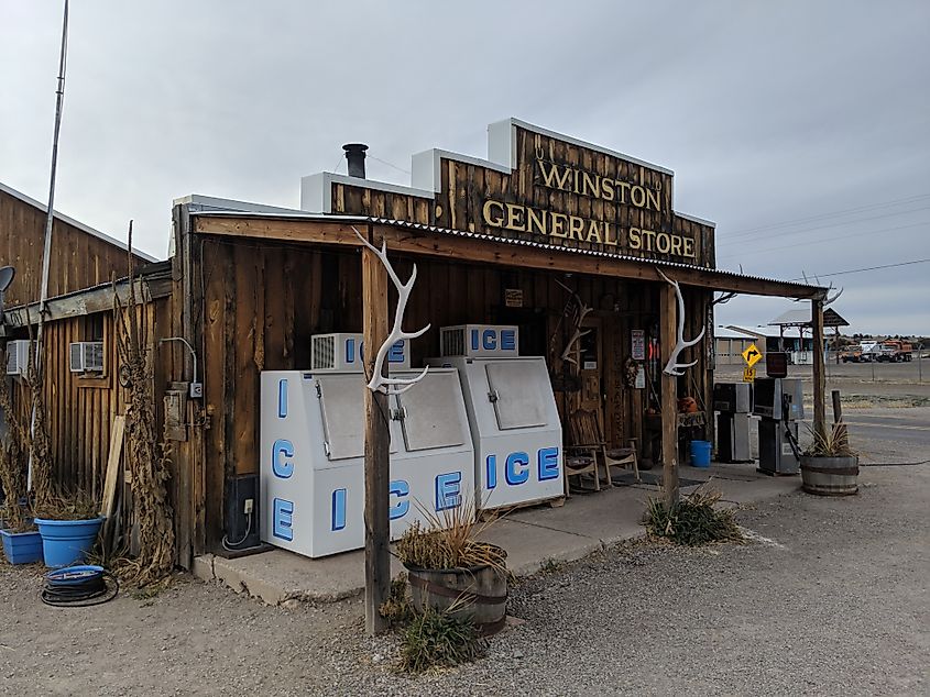 Winston General Store in Winston, New Mexico, a small wooden building with a front porch, rustic signage, and desert surroundings