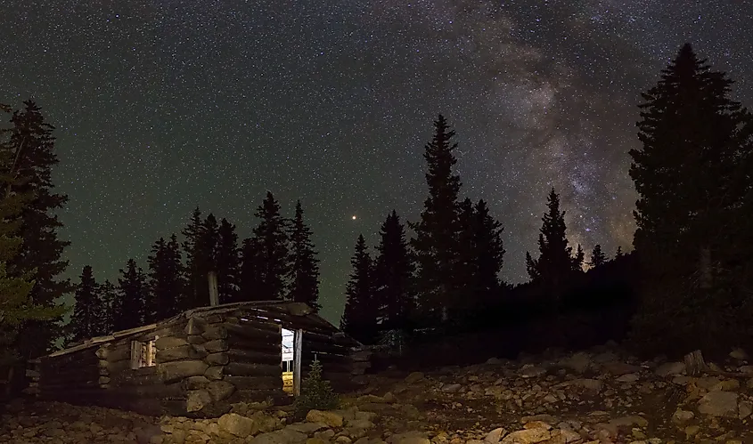 Alpine cabin in Great Basin National Park under a starry sky.