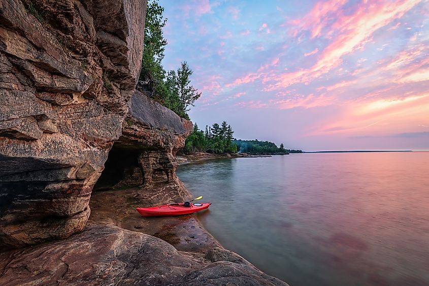 Kayaking along Lake Superior Caves near Munising, Michigan.