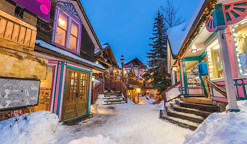 Breckenridge, Colorado, USA downtown streets at night in the winter with holiday lighting.